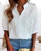Blouse blanche femme à col V et manches bouffantes