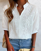 Blouse blanche femme à col V et manches bouffantes
