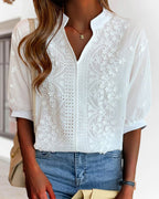 Blouse blanche femme à col V et manches bouffantes