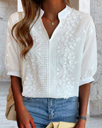 Blouse blanche femme à col V et manches bouffantes