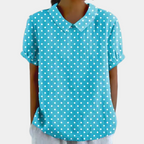Blouse femme à fleurs pastel, col rond et manches courtes, bleu clair