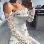 Combinaison femme épaules dénudées, taille nouée, manches longues