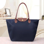 Sac porté épaule femme zippé, trois formats, neuf coloris, bleu marine