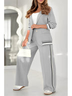 Ensemble tailleur femme blazer ajusté et pantalon large taille haute, gris