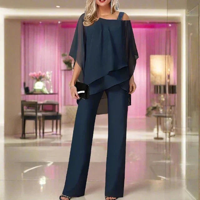 Ensemble femme combinaison pantalon et blouse à épaule asymétrique, bleu marine