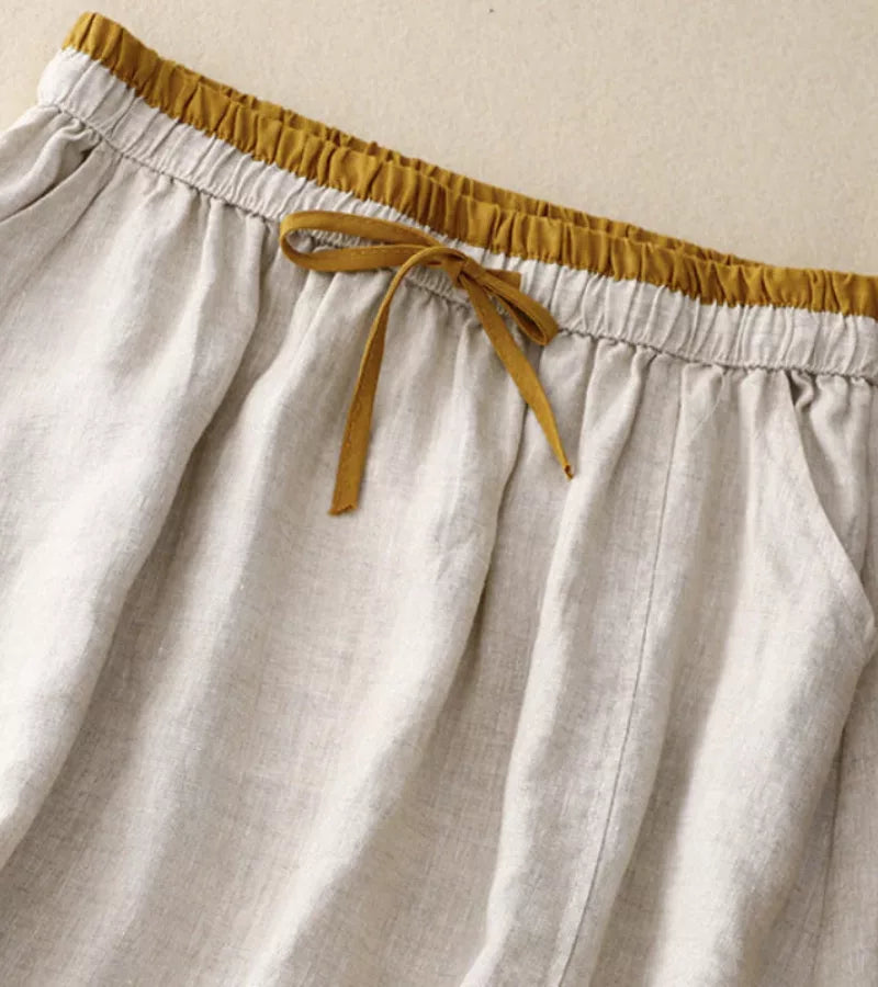 Jupe mi-longue femme trapèze taille haute, broderies et poches