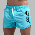 Short de bain homme uni à séchage rapide, cinq coloris, bleu