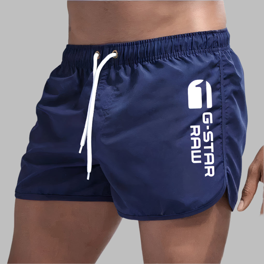 Short de bain homme uni à séchage rapide, cinq coloris, bleu marine