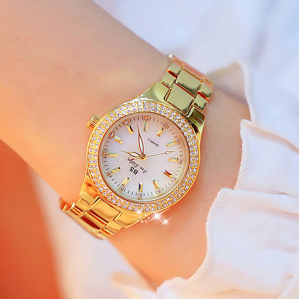 Montre femme à cadran rond irisé entouré de strass, doré