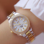 Montre femme à cadran rond irisé entouré de strass, doré et argenté