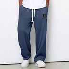 Pantalon homme texture gaufrée, coupe droite, dix coloris, bleu