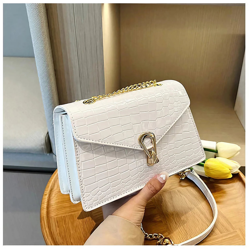 Sac bandoulière femme effet croco, forme allongée, six coloris, bleu