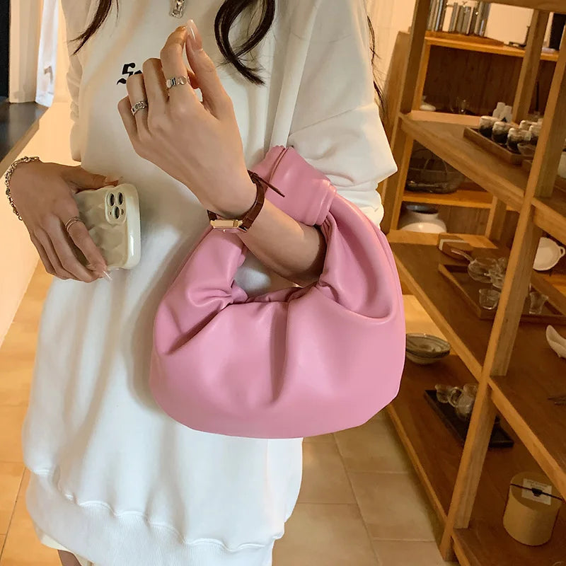 Petit sac à main femme arrondi, anse à gros nœud, en similicuir