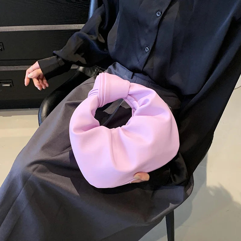 Petit sac à main femme arrondi, anse à gros nœud, en similicuir