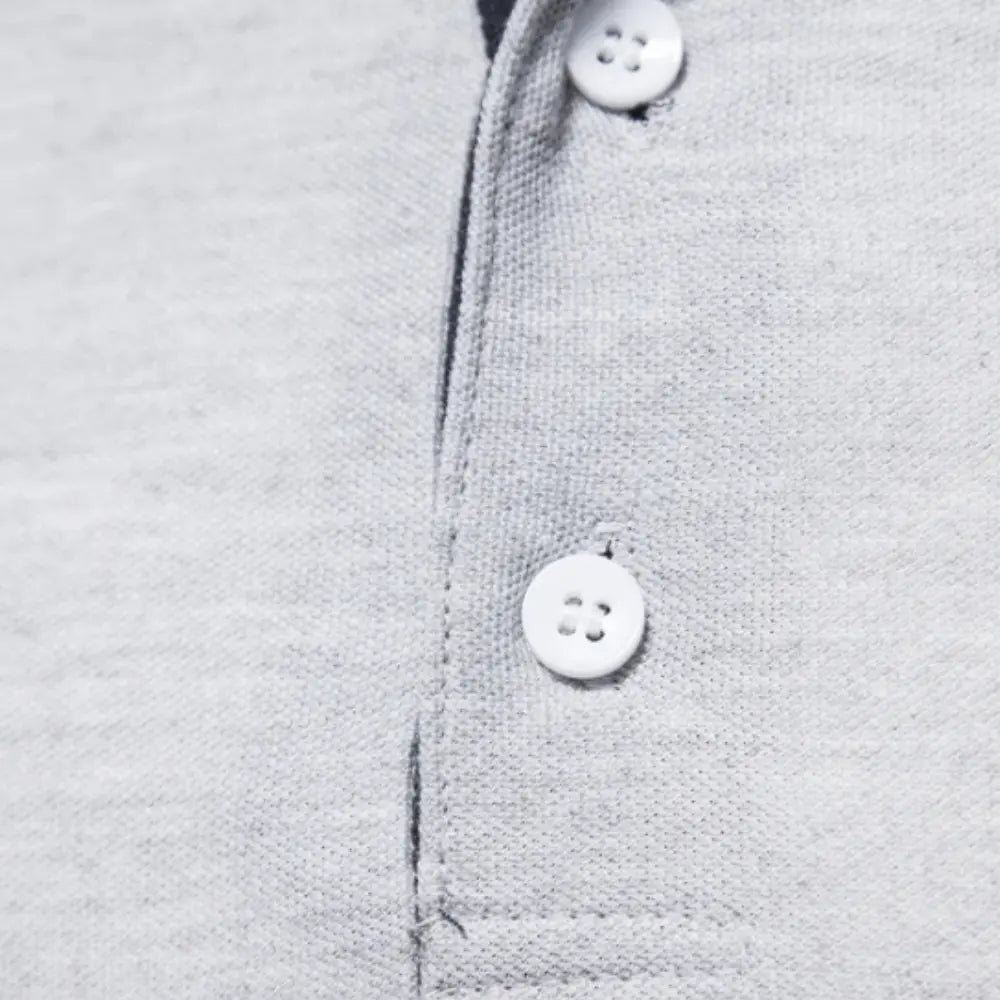 Polo homme à manches longues, col contrasté, trois boutons
