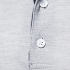 Polo homme à manches longues, col contrasté, trois boutons