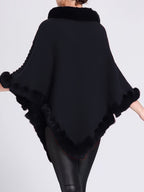 Poncho tricoté femme à col montant et bordures en fourrure