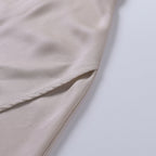 Robe longue de soirée à décolleté croisé et fente latérale