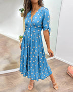 Robe à pois mi-longue, manches nouées et coupe cintrée