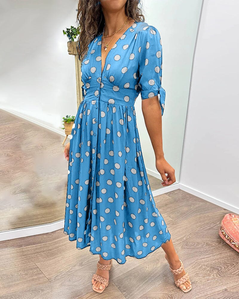 Robe à pois mi-longue, manches nouées et coupe cintrée