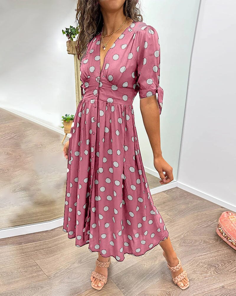 Robe à pois mi-longue, manches nouées et coupe cintrée