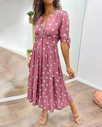 Robe à pois mi-longue, manches nouées et coupe cintrée
