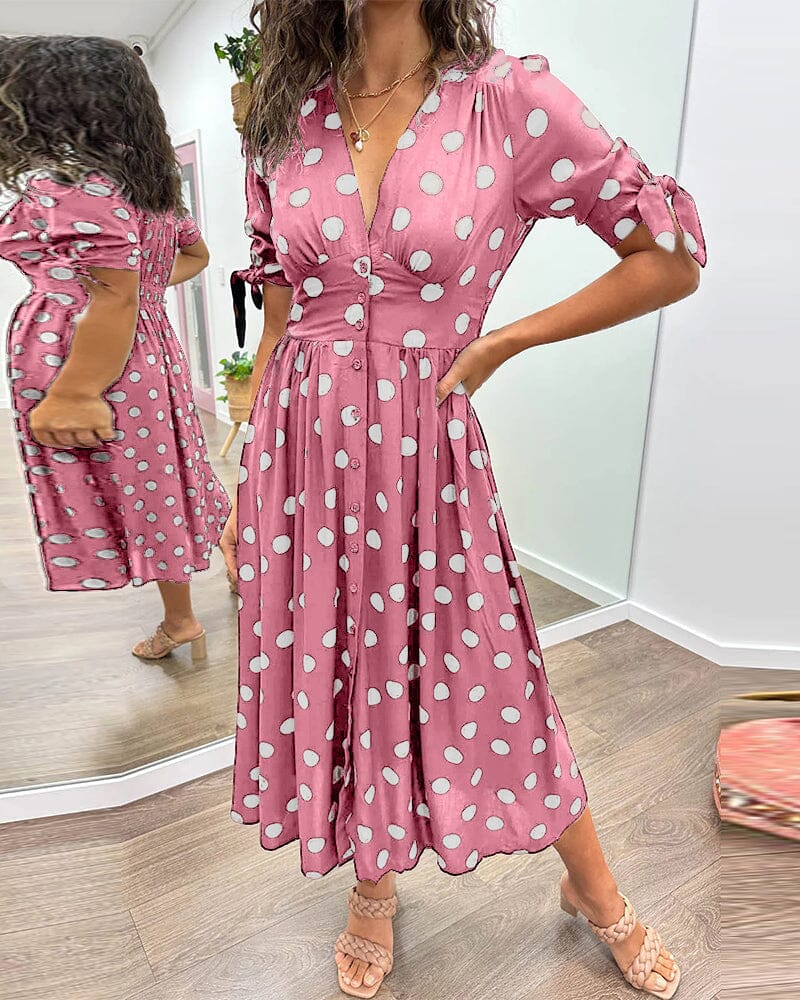 Robe à pois mi-longue, manches nouées et coupe cintrée, rose