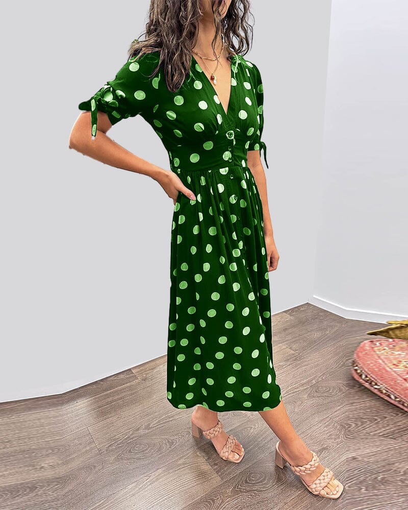 Robe à pois mi-longue, manches nouées et coupe cintrée
