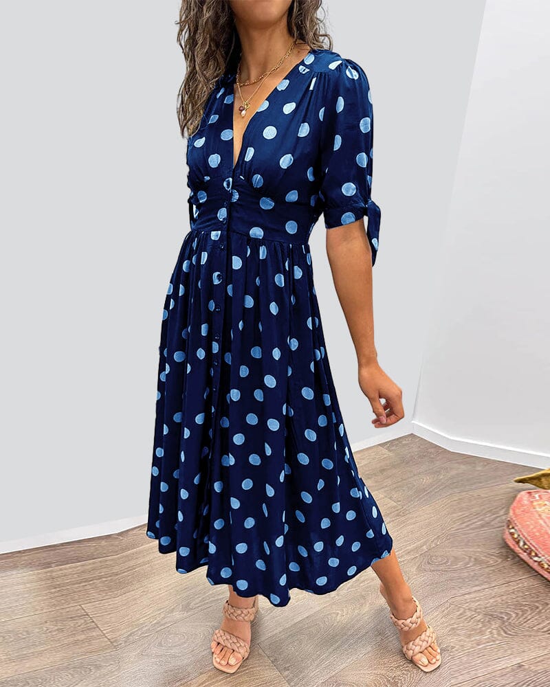 Robe à pois mi-longue, manches nouées et coupe cintrée