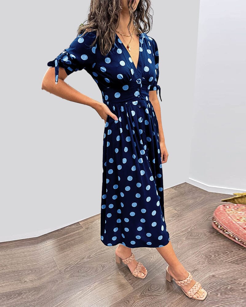 Robe à pois mi-longue, manches nouées et coupe cintrée