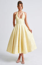 Robe midi dos nu à col licou, corsage effet corset, jupe évasée, jaune clair