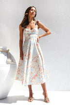 Robe midi fleurie à bretelles nouées, coupe cintrée, deux coloris