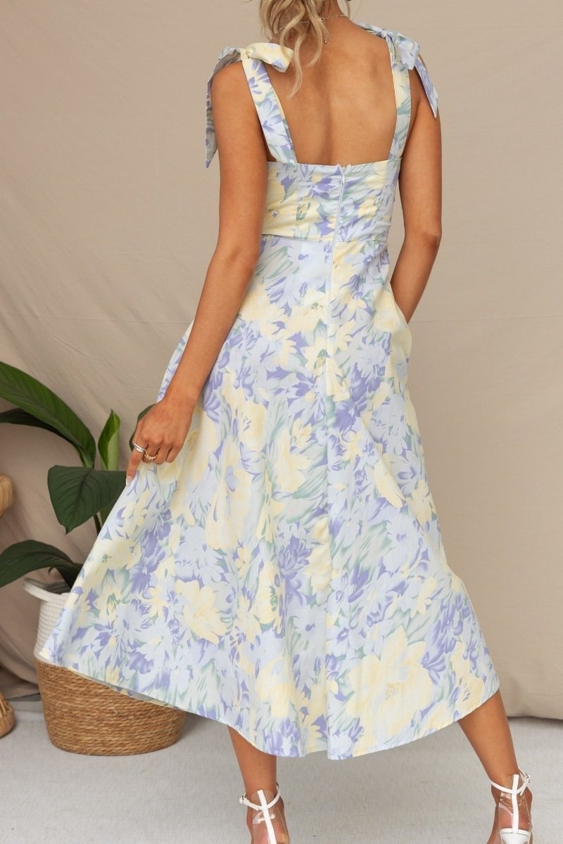 Robe midi fleurie à bretelles nouées, coupe cintrée, deux coloris