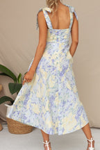 Robe midi fleurie à bretelles nouées, coupe cintrée, deux coloris
