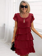 Robe midi fluide à ourlet asymétrique et volants superposés