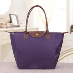 Sac bandoulière femme en trois formats, neuf coloris, pourpre