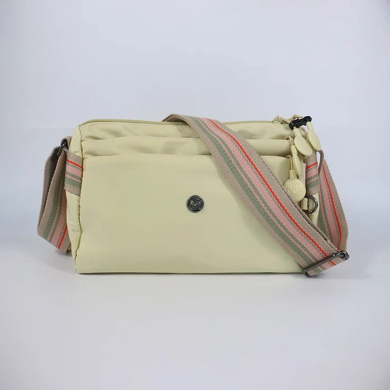 Sac banane femme en nylon imperméable, quatre poches zippées, écru