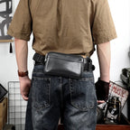 Sac banane homme en cuir noir à compartiments, porté main ou taille