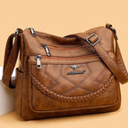 Sac bandoulière femme zippé à bouton aimanté, quatre coloris