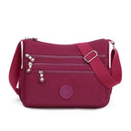 Sac bandoulière femme multipoches en tissu Oxford déperlant, rouge framboise