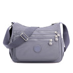Sac bandoulière femme multipoches en tissu Oxford déperlant, gris et mauve