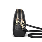 Sac bandoulière noir femme imprimé croco, détails dorés