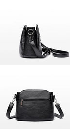 Petit sac bandoulière femme noir en similicuir, poches zippées