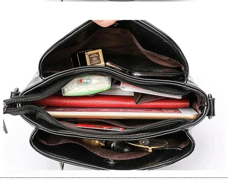 Petit sac bandoulière femme noir en similicuir, poches zippées