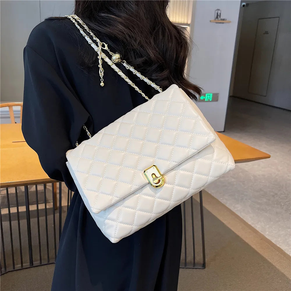 Sac matelassé femme à chaîne coulissante dorée, 27 x 18 cm