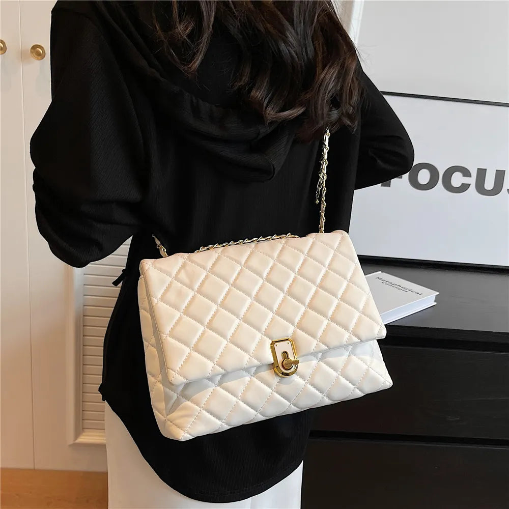 Sac matelassé femme à chaîne coulissante dorée, 27 x 18 cm