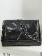 Sac épaule femme noir à chaîne métallique et rabat
