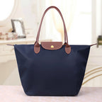 Sac à bandoulière femme, trois formats, neuf coloris, bleu marine