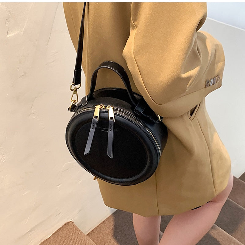 Sac rond noir femme, forme profonde, bandoulière amovible