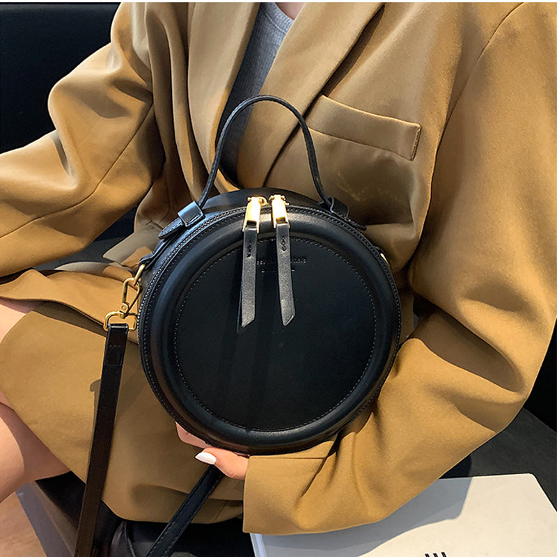 Sac rond noir femme, forme profonde, bandoulière amovible